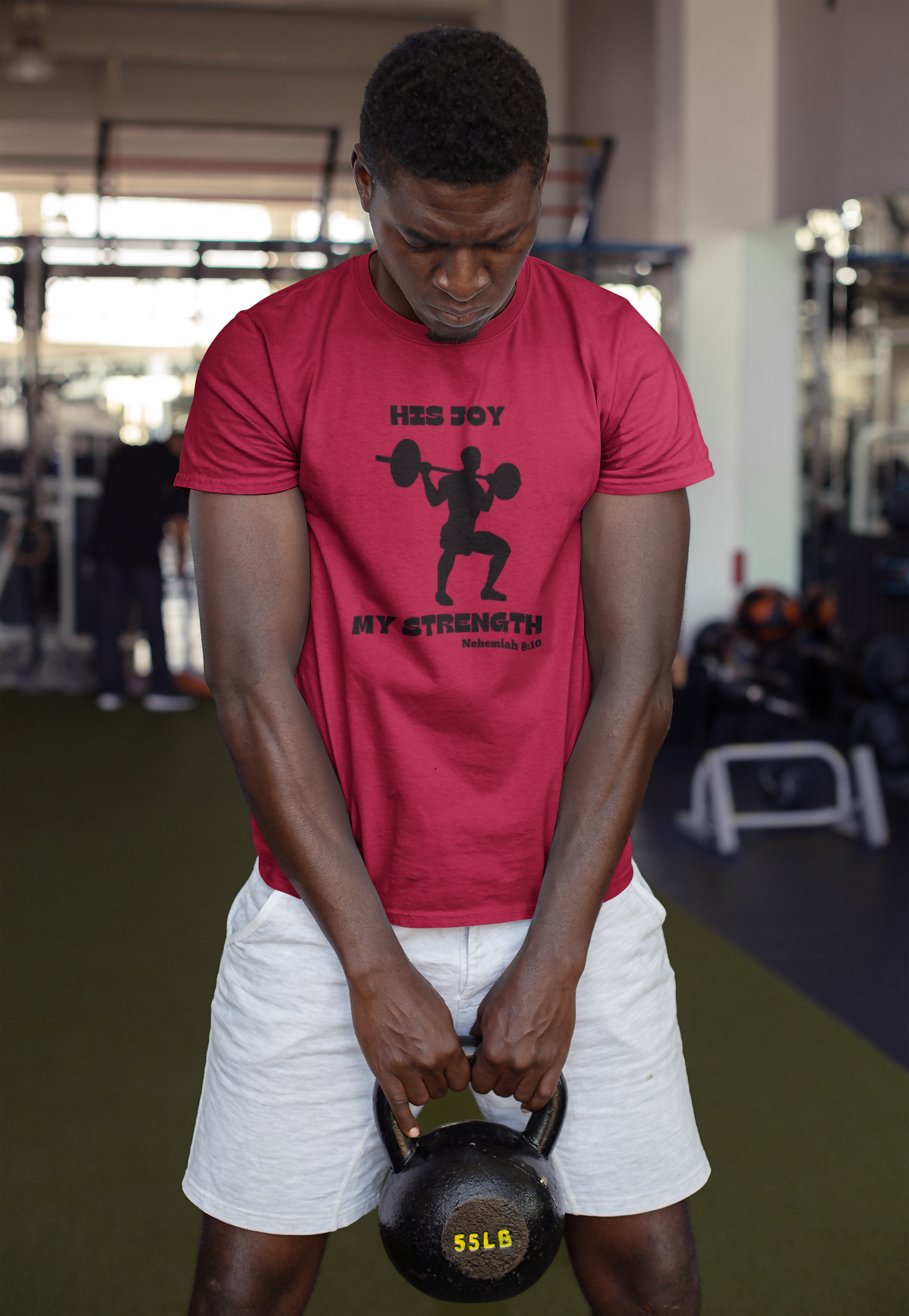 round-neck-tee-mockup-of-a-strong-man-holding-a-kettlebell-at-the-gym-23641