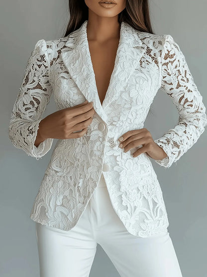 White lace blazer worn by a model on a gray background