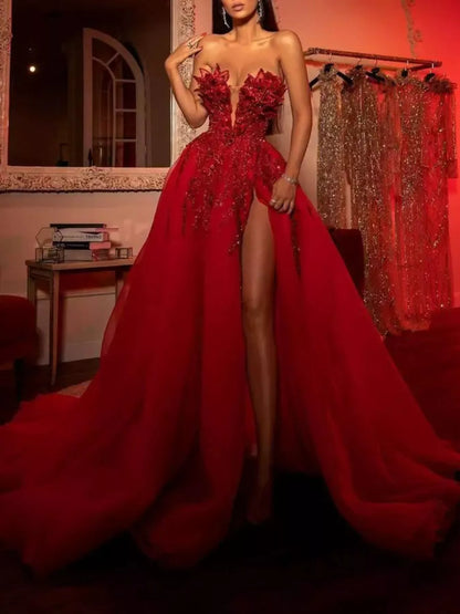 Red strapless sequin evening gown with high slit