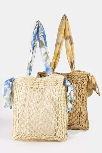 Openwork straw tote with floral scarf-wrapped handles