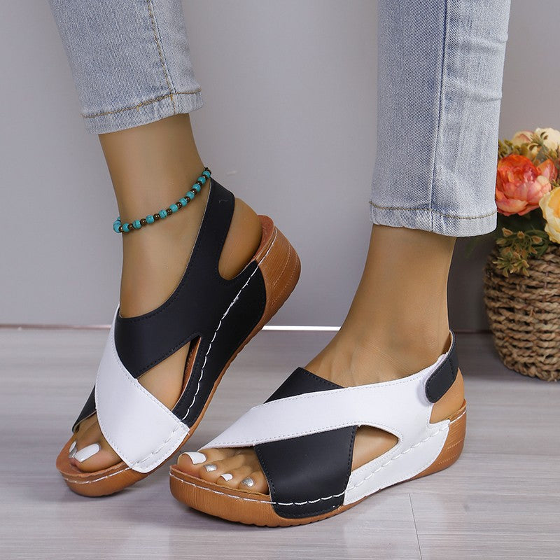 Crisscross wedge sandals in black and white
