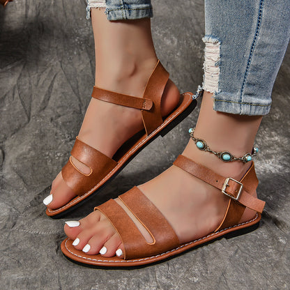 Open toe buckle flat sandals in black or terracotta