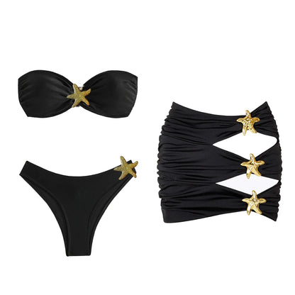Black bikini set with gold star accents on a white background
