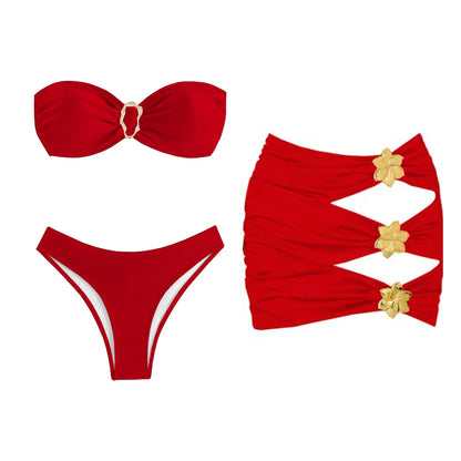 Red bikini set with gold floral details on a white background