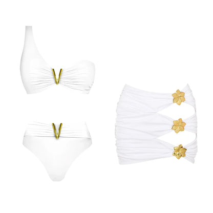 White bikini set with gold details on a white background